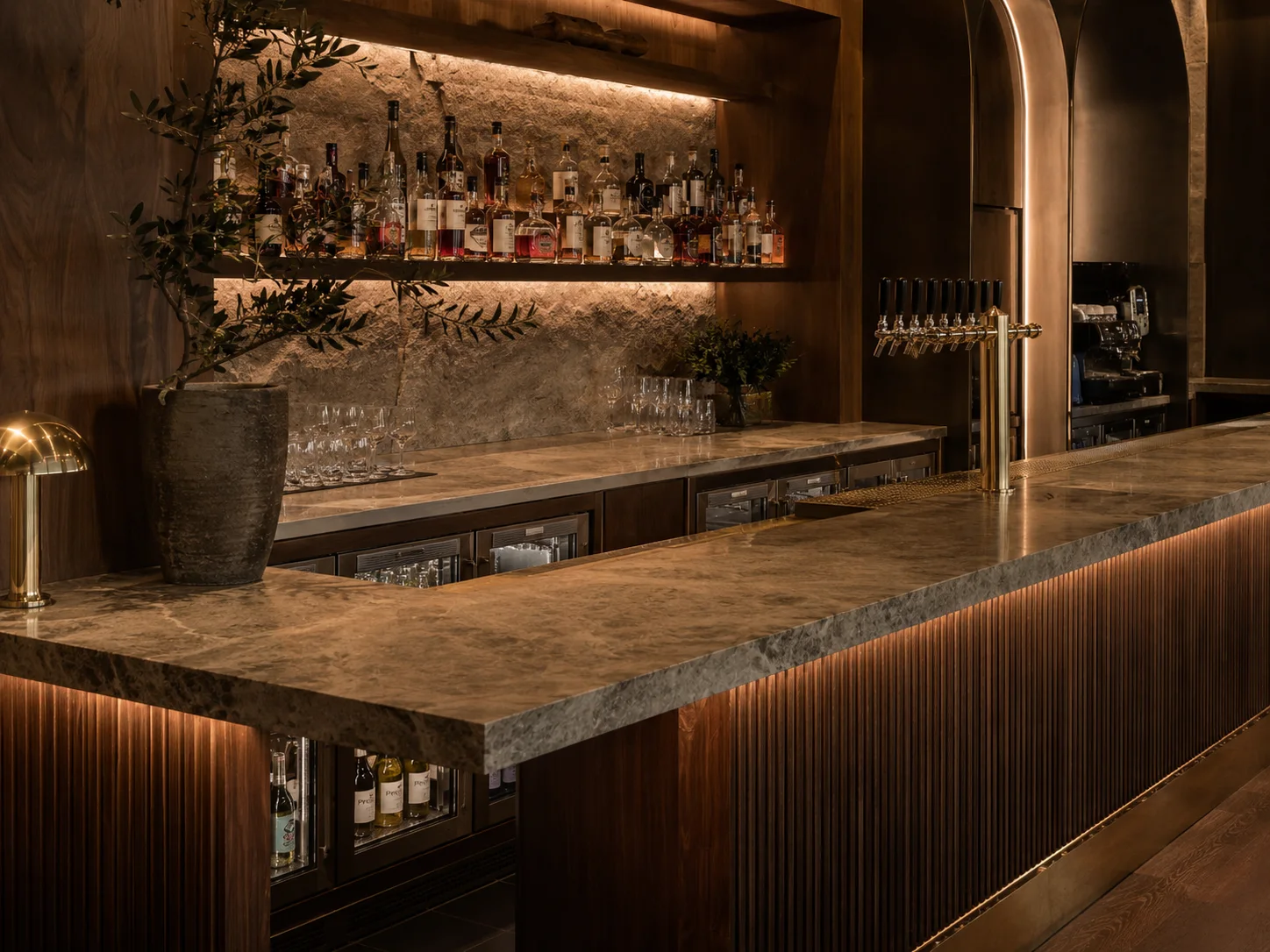 Premium bar counter detail Sydney venue with custom joinery, integrated refrigeration, tap system and feature lighting