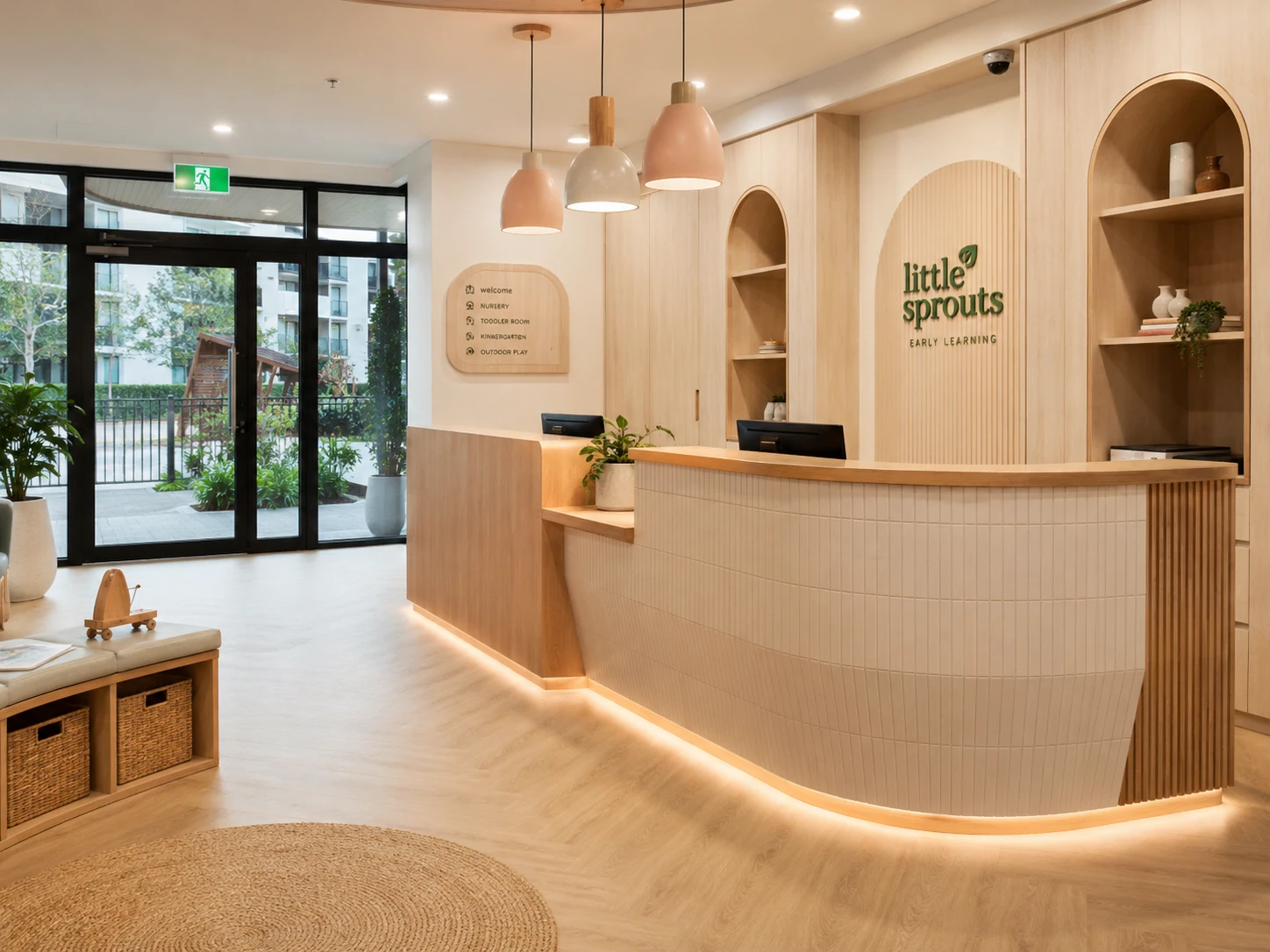 Childcare centre reception and entry area Sydney with custom joinery desk, welcoming warm environment and professional finishes